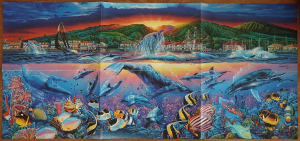 A panoramic scene showing whales and dolphins above and below the ocean surface at sunset near a coastal town.