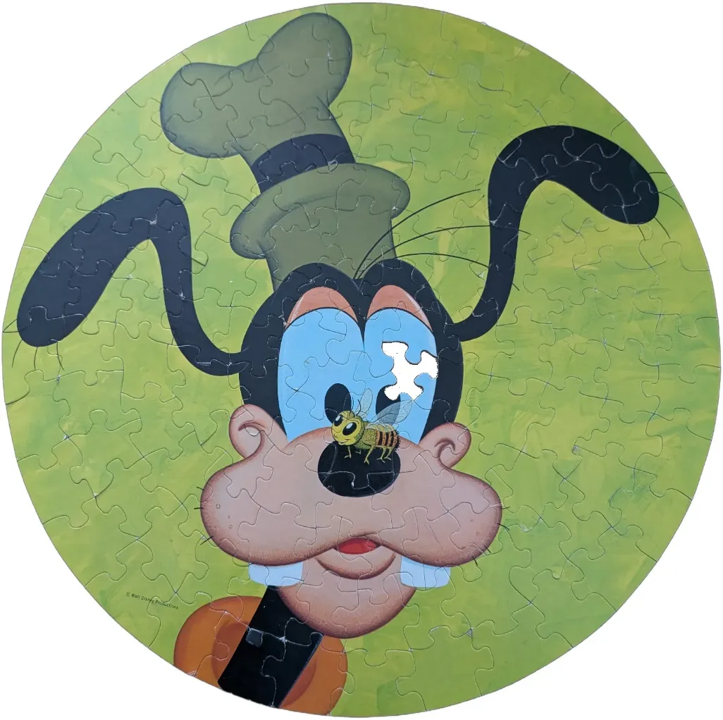 Goofy the cartoon dog with a bumblebee on his nose against a green background