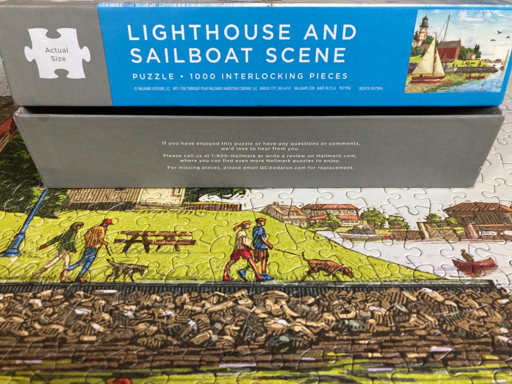 Lighthouse and Sailboat Scene