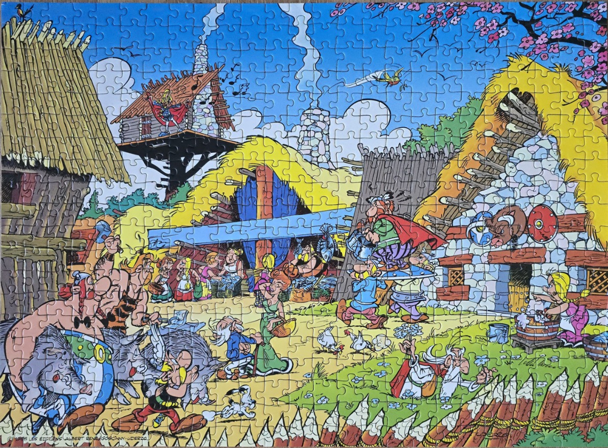 Cartoon illustration of a busy Gallic village with Asterix, Obelix, and various villagers.