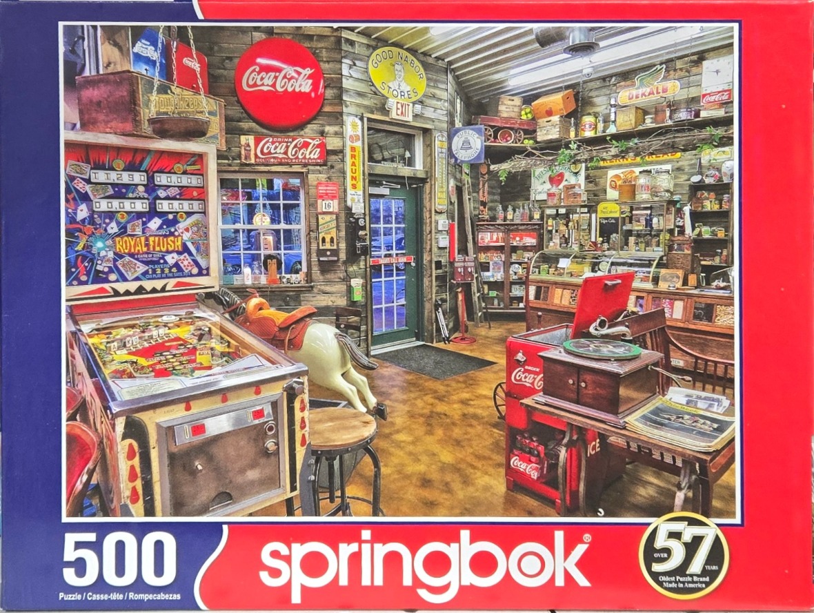 A nostalgic interior of a vintage general store filled with antiques, Coca-Cola memorabilia, and a pinball machine.