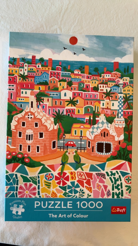 Stylized illustration of Park Güell in Barcelona featuring colorful mosaic patterns and two green parrots.