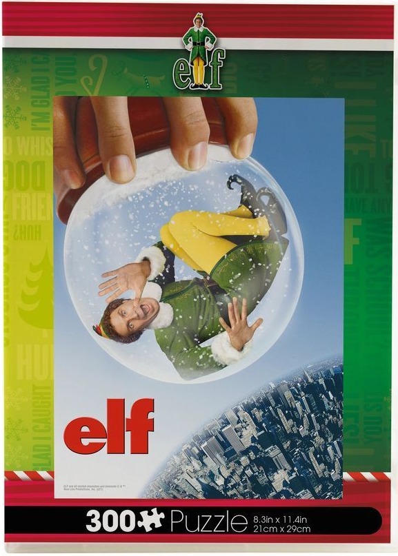 A hand holding a snow globe containing a man dressed as an elf over a city skyline.