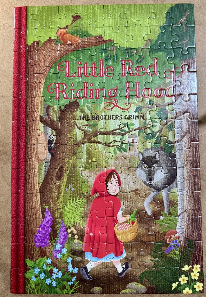 A book cover illustration of Little Red Riding Hood walking through a forest with the Big Bad Wolf.