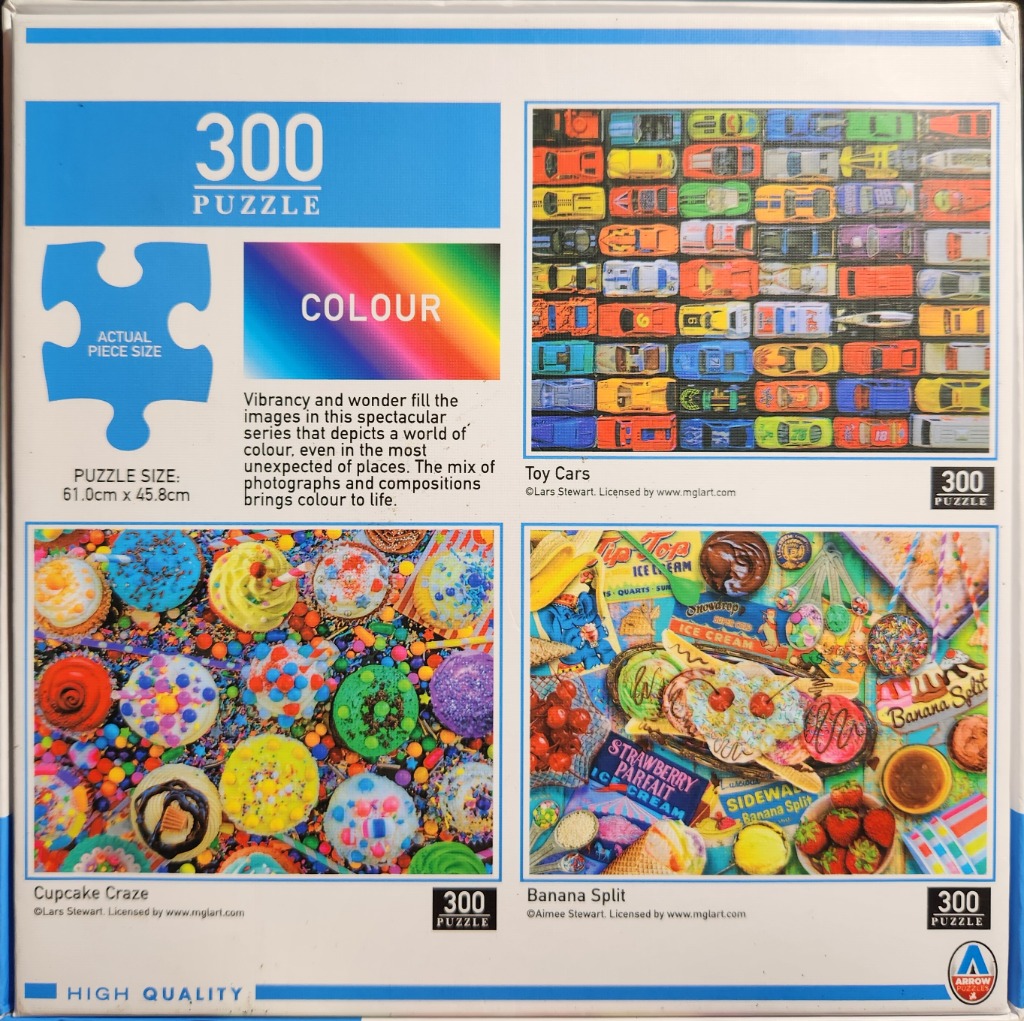 Colorful jigsaw puzzle featuring toy cars, cupcakes, and ice cream.