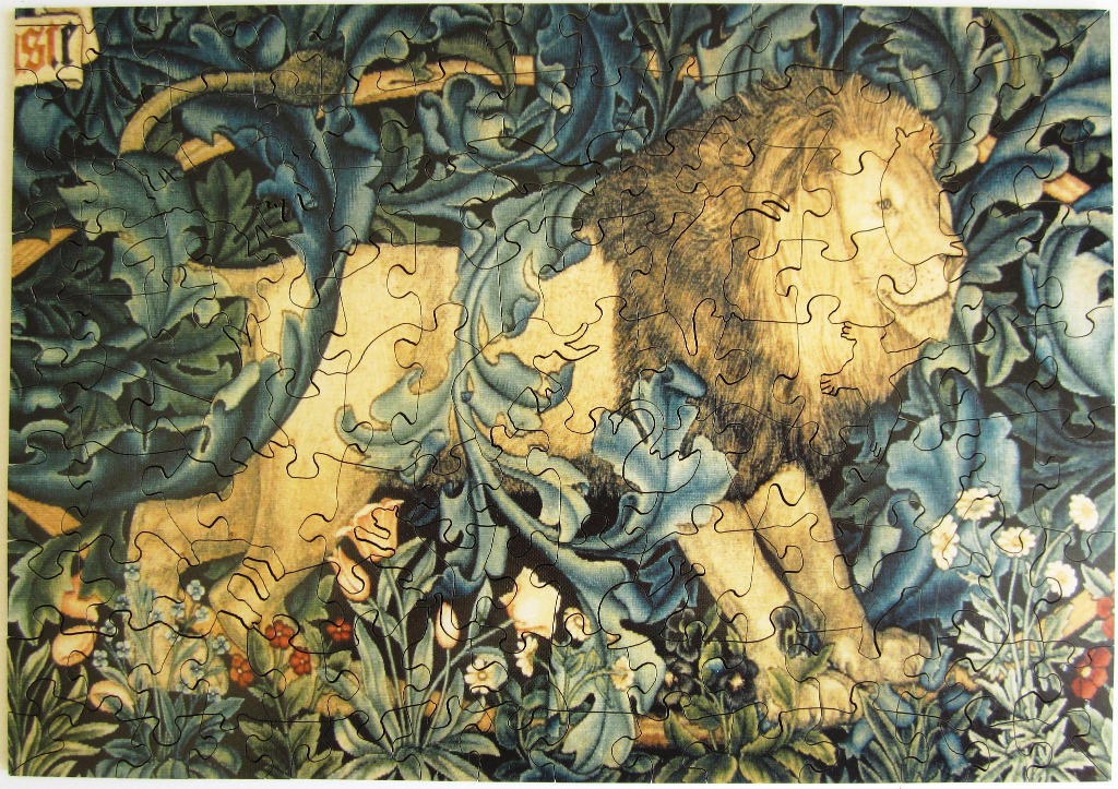 A lion walking through dense blue-green acanthus leaves and flowers in a medieval tapestry style.