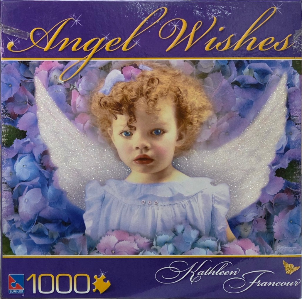 A curly-haired young child with white angel wings surrounded by blue and purple hydrangea flowers.