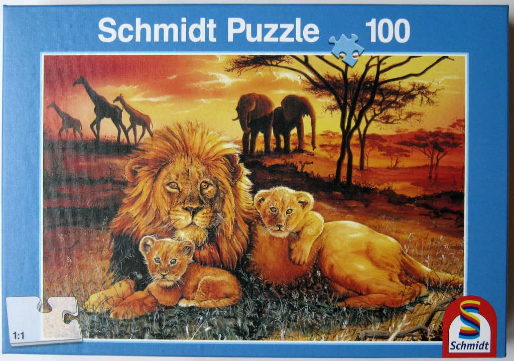 A pride of lions resting in an African savanna at sunset with giraffes and elephants in the background.