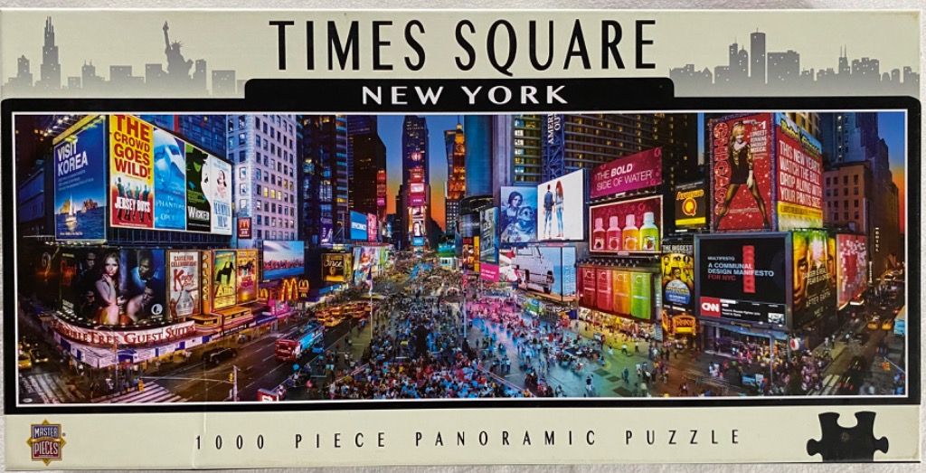 A panoramic photograph of a bustling, twilight scene in Times Square, New York, illuminated by massive electronic billboards.