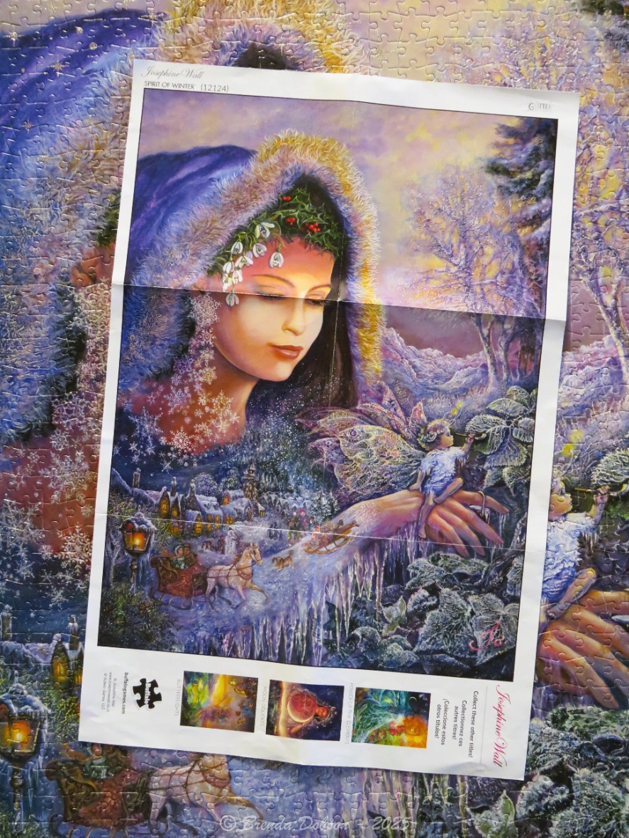 An ethereal winter scene featuring a large female spirit overlooking a snowy village with a small fairy.