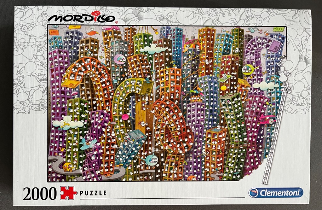 A cartoon illustration of a chaotic, brightly colored city with twisted skyscrapers filled with small white creatures.