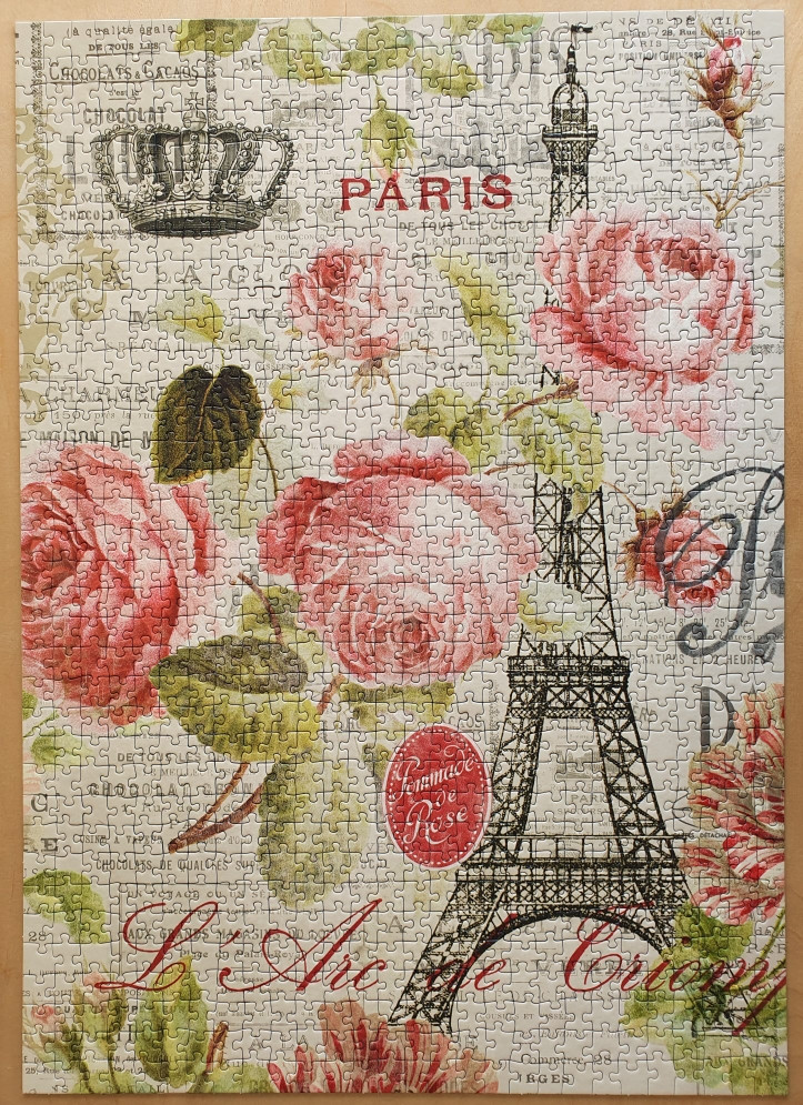 Vintage-style collage featuring roses, the Eiffel Tower, a crown, and French text in a soft, sepia-toned colour palette.