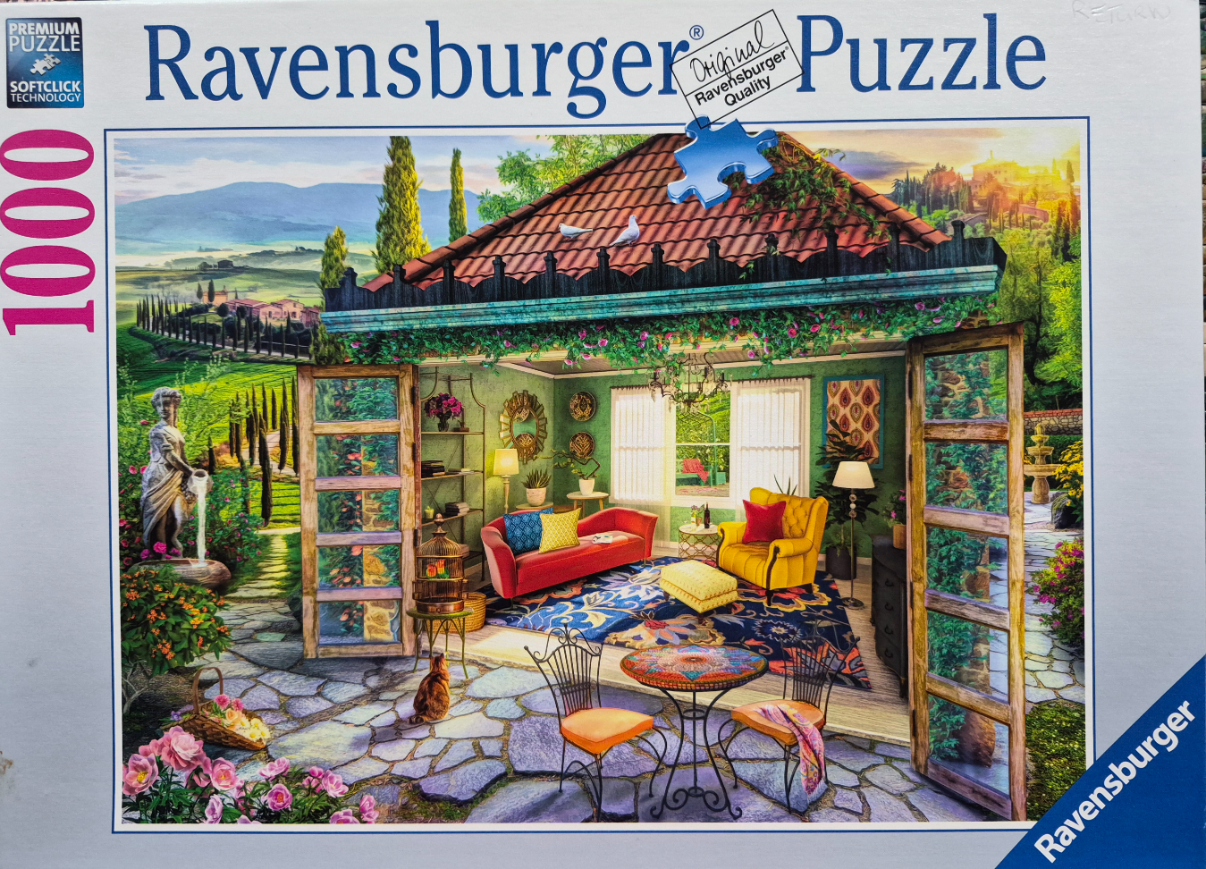 A cozy garden room with open doors, plush furniture, and a sun-drenched Italian-style landscape in the background.