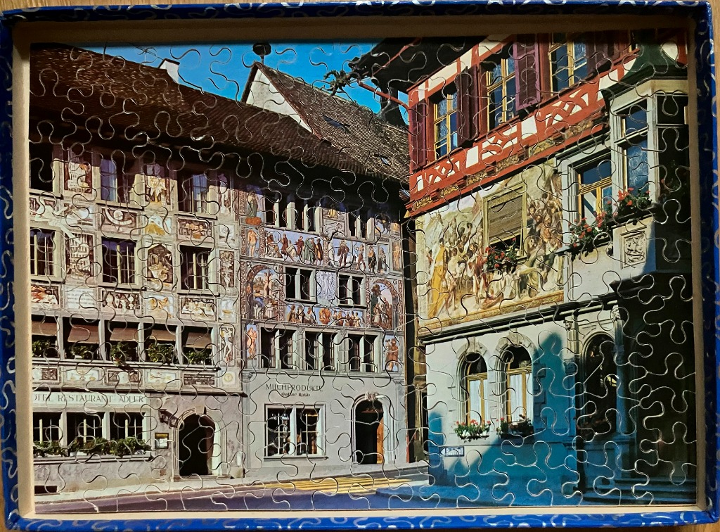 Street-level view of historic half-timbered buildings in Stein am Rhein, Switzerland, with elaborate painted facades.
