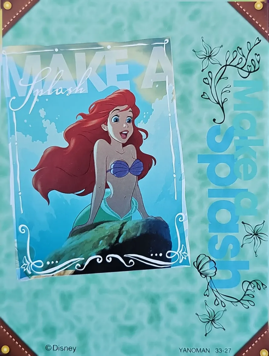 Ariel from The Little Mermaid sitting on a rock against a teal background with the text Make a Splash.