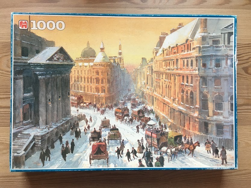 Painting of a snowy 19th-century London street scene with horse-drawn carriages and classical architecture.