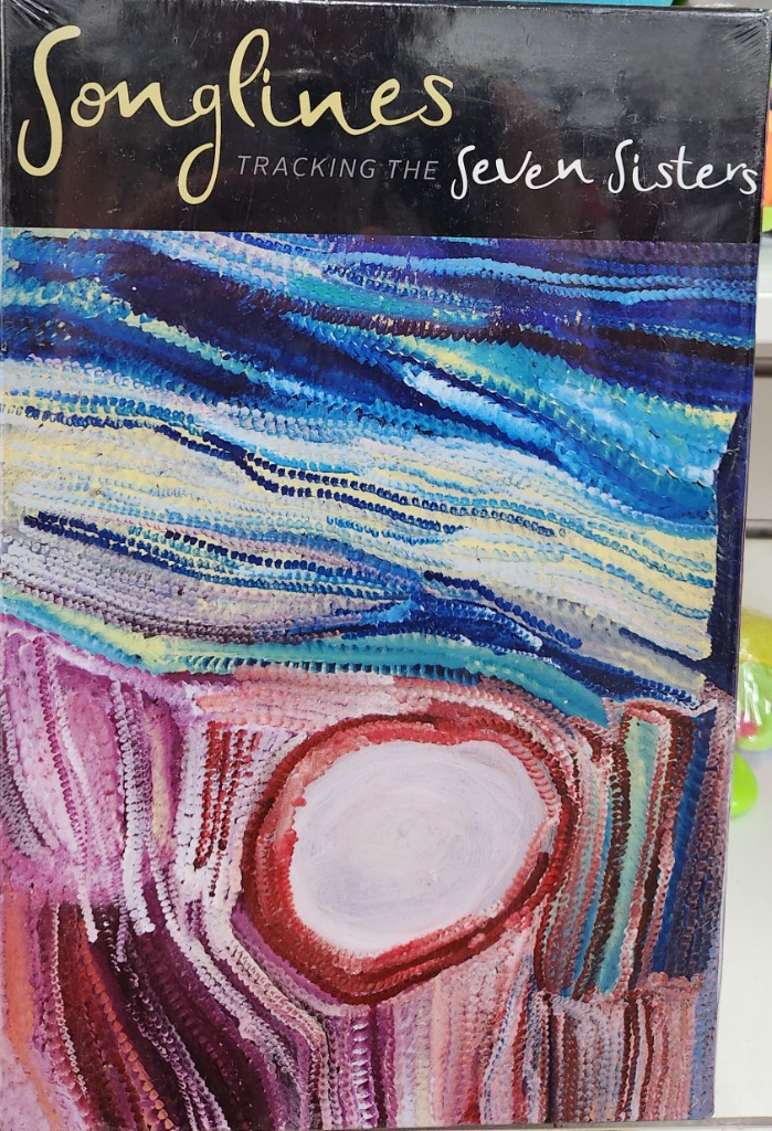 Abstract Indigenous Australian dot painting with horizontal bands of blue, yellow, and violet, and a central circular form.