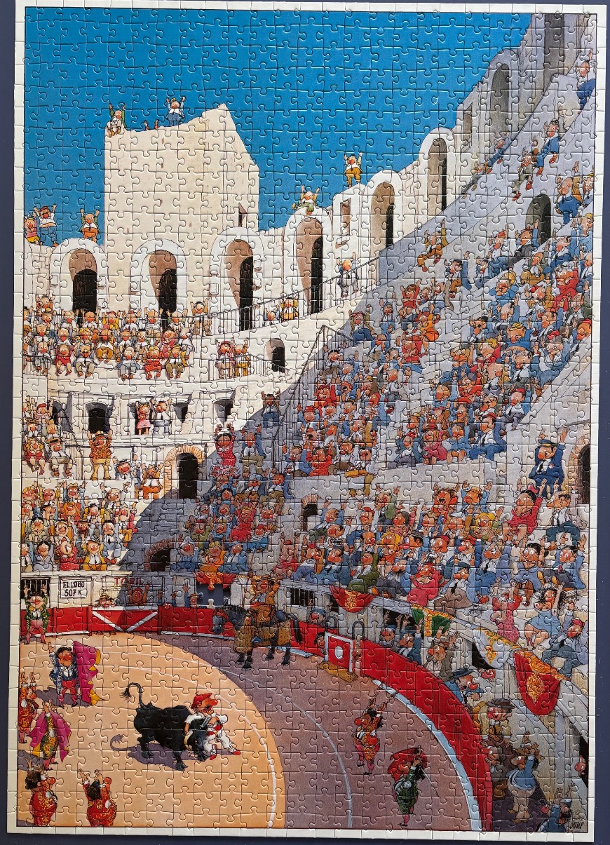 Cartoon illustration of a bullfight in a crowded stone arena under a bright blue sky.