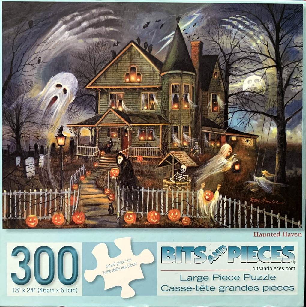 Haunted Victorian house at night with ghosts, skeletons, and carved pumpkins in the yard.