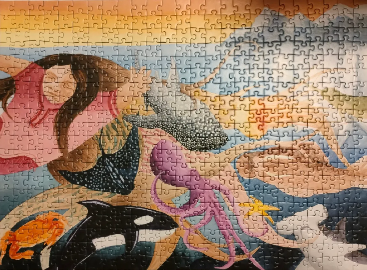 An illustration of a woman swimming underwater surrounded by various marine animals in a sunset-lit ocean.