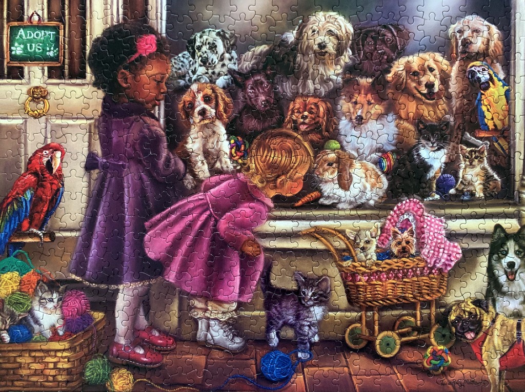 Two young girls peering into a pet store window filled with various puppies, kittens, and birds.