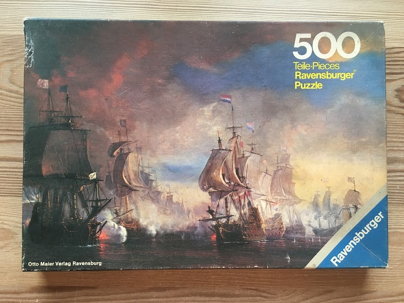 An oil painting of a fleet of 17th-century sailing ships engaged in a naval battle at sea.