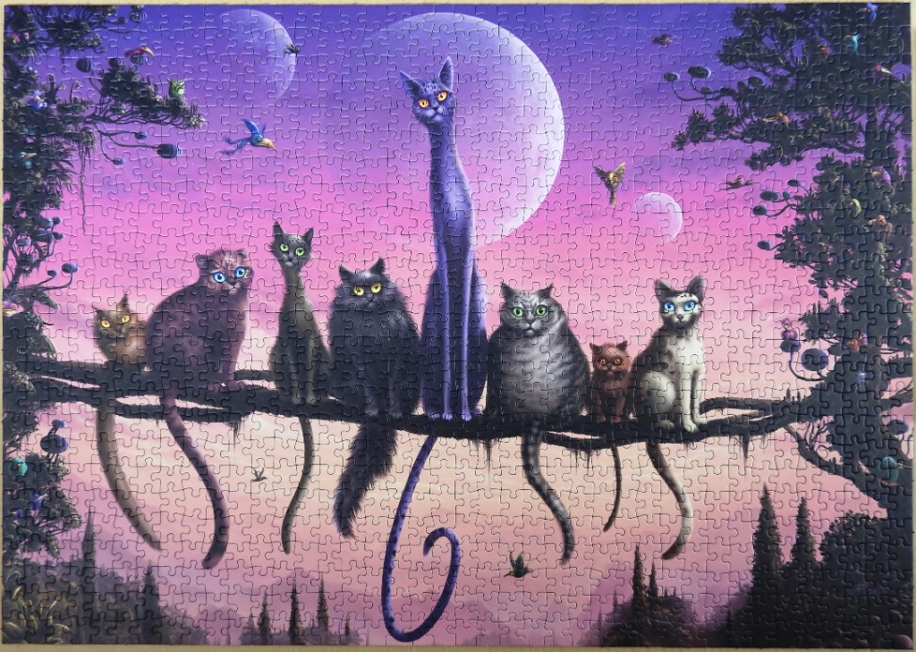 Seven stylized cats perched on a tree branch against a purple twilight sky with two moons.