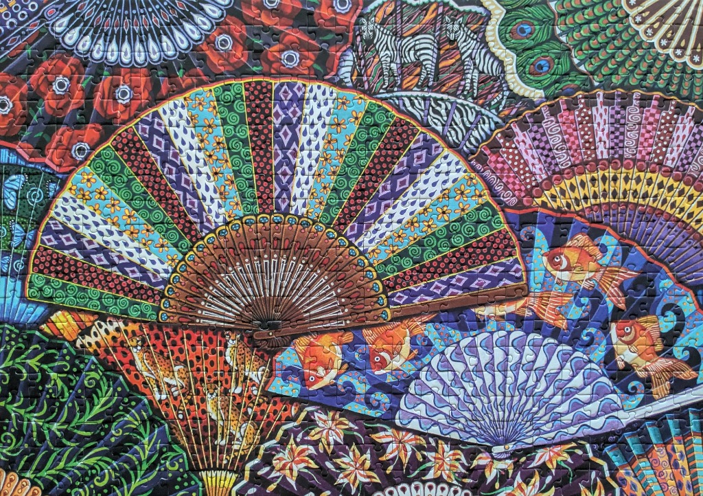 An overlapping collage of ornate, patterned hand fans featuring animal and floral motifs in vibrant colours.