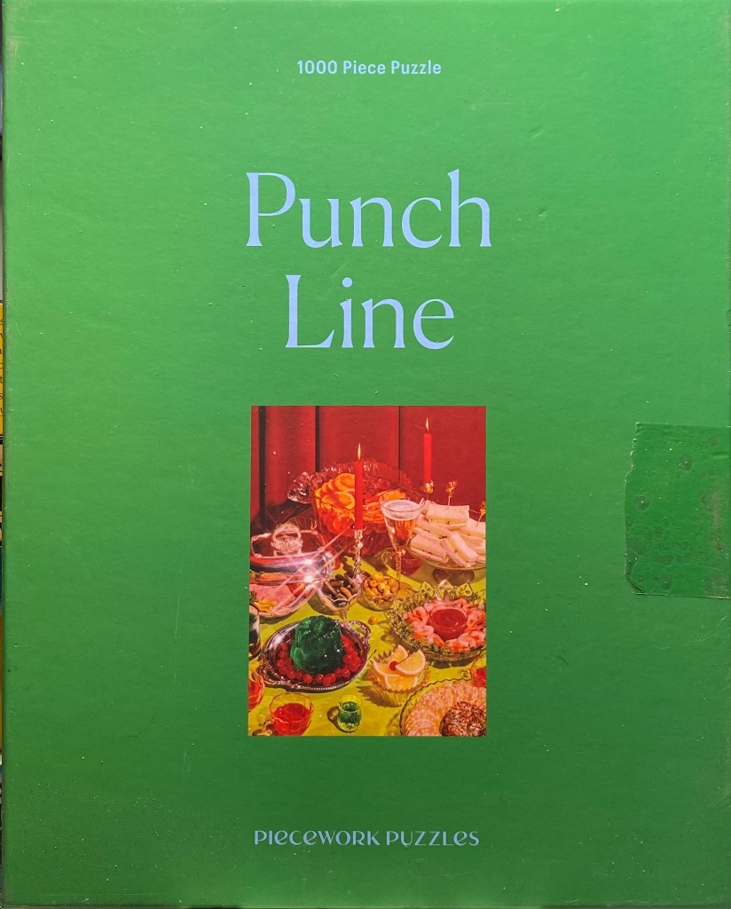 A green background with the words Punch Line and a centered photograph of a retro cocktail party spread.