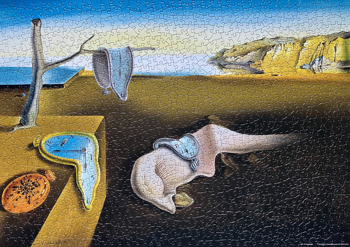 The Persistence of Memory by Salvador Dalí surrealist painting
