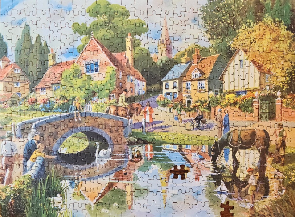 A charming English village scene with a stone bridge over a stream, cottages, and people with horses.