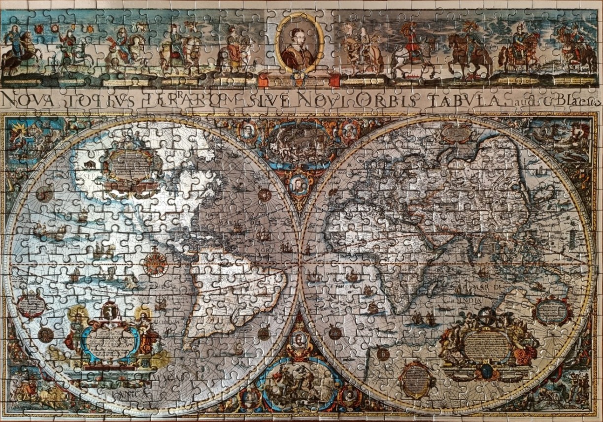 An antique 17th-century style double-hemisphere world map with intricate illustrations and Latin text.