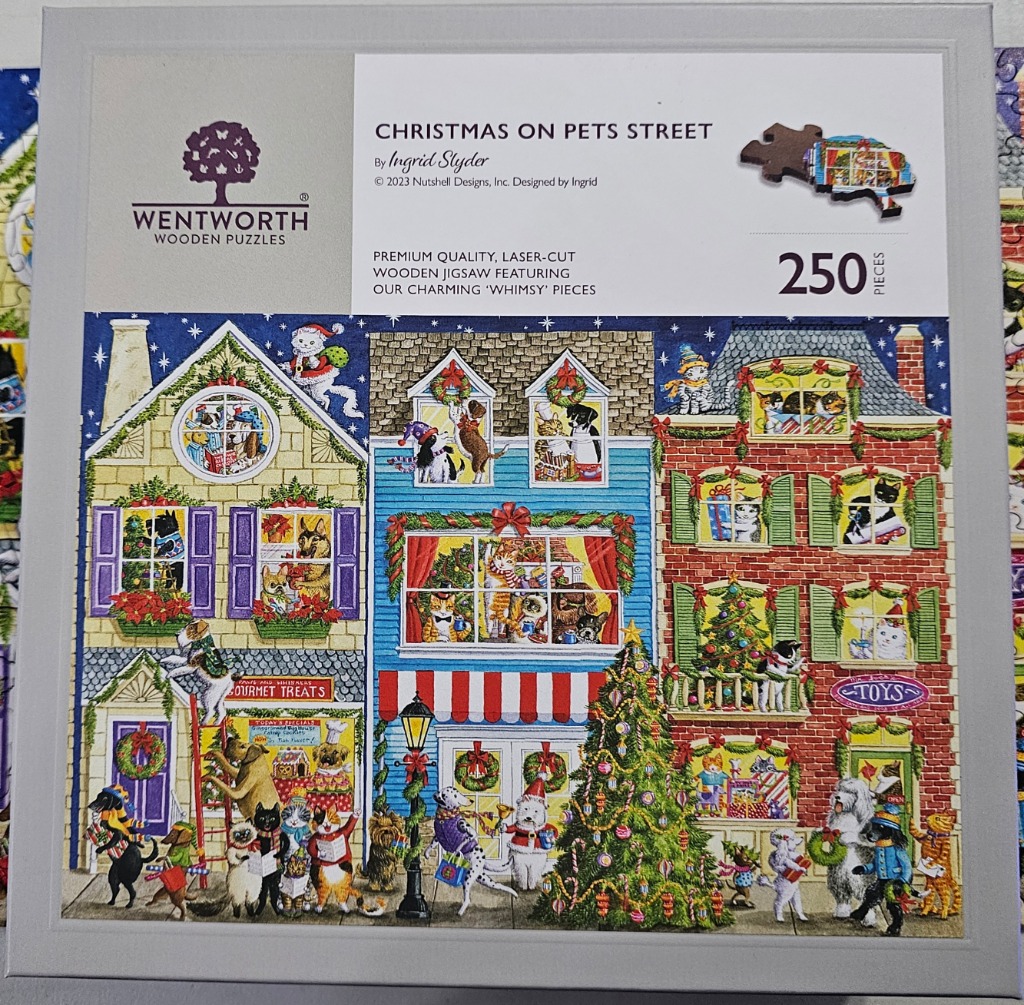 An illustration of three buildings decorated for Christmas, populated by various cats and dogs