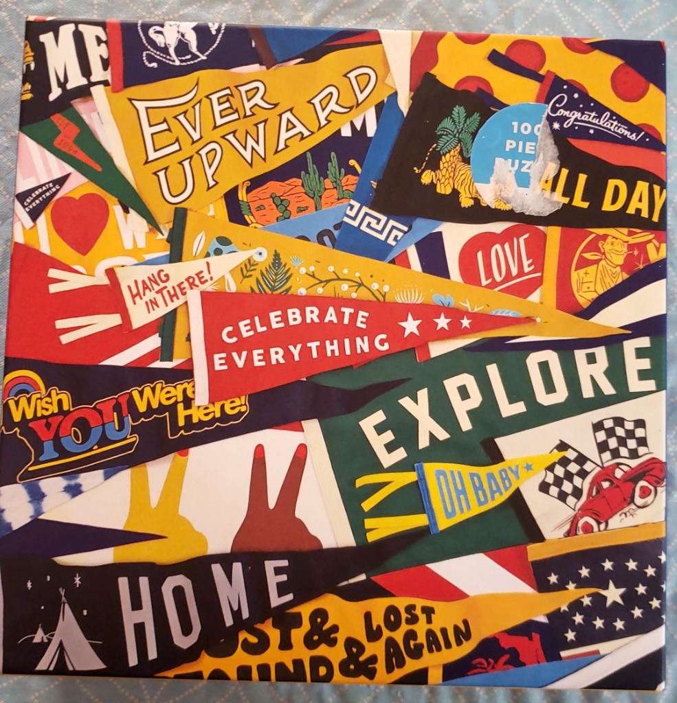A collage of various colorful vintage-style felt pennants featuring motivational slogans and graphic illustrations.