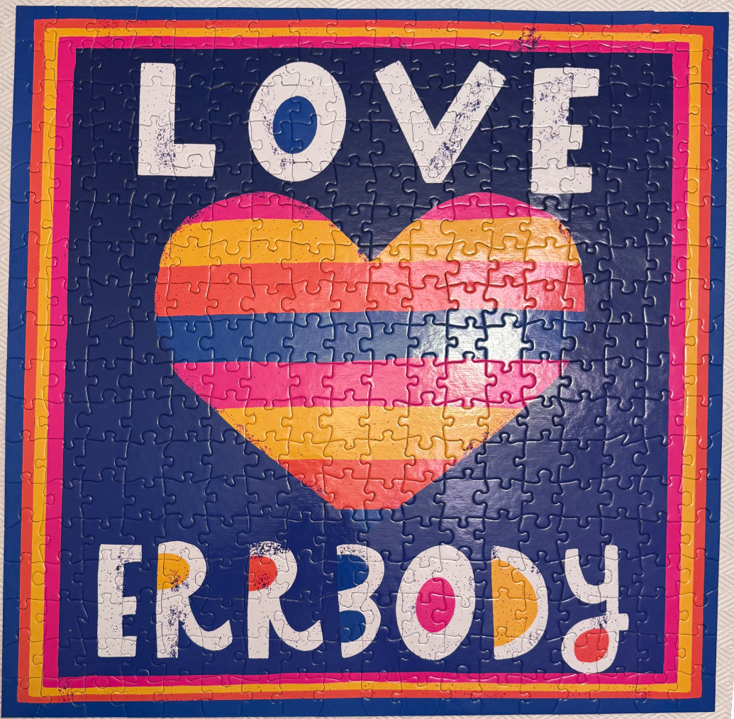 A graphic art print with the text LOVE ERRBODY and a central striped heart on a dark blue background.
