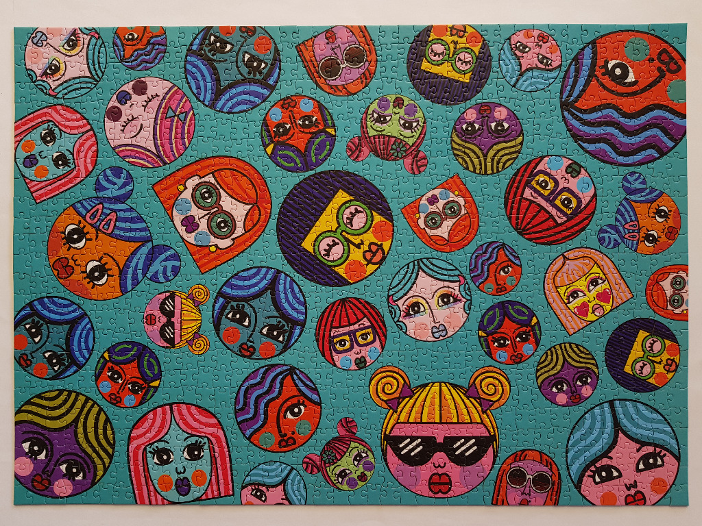 A vibrant pattern of diverse cartoon doll faces in various shapes and colours against a bright turquoise background.
