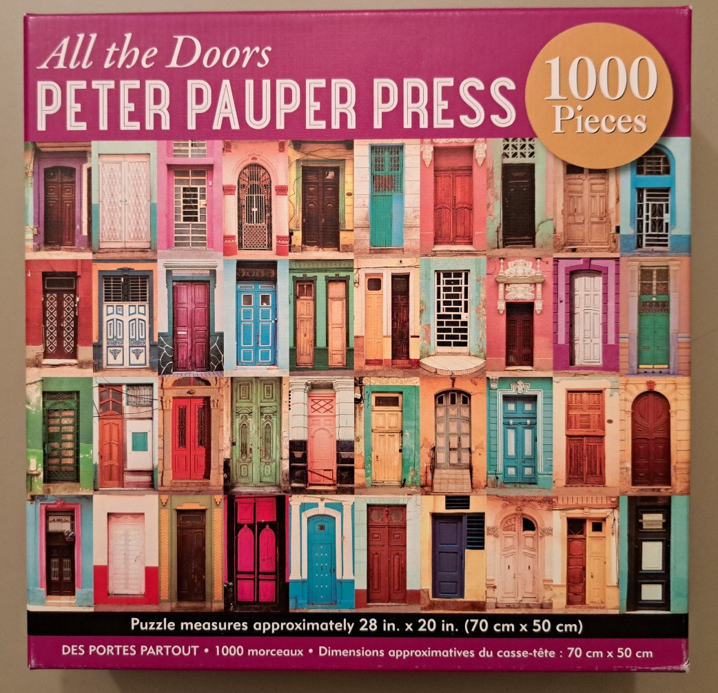 A collage of 30 colorful, varied architectural doors arranged in a grid pattern.