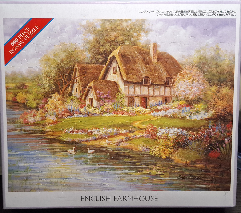 A peaceful English countryside scene featuring a thatched-roof cottage by a pond filled with flowers and white swans.