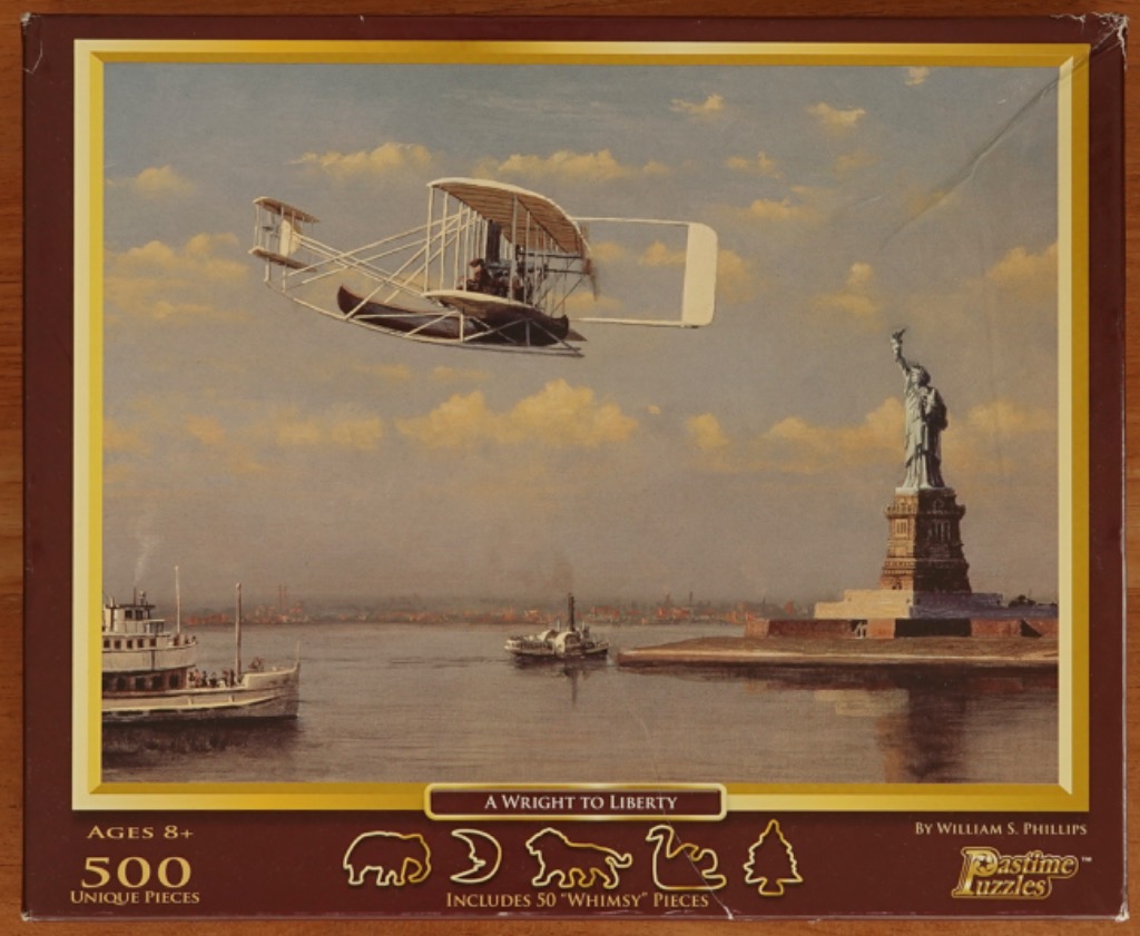 Historical painting of the Wright Flyer biplane flying over New York Harbor near the Statue of Liberty.