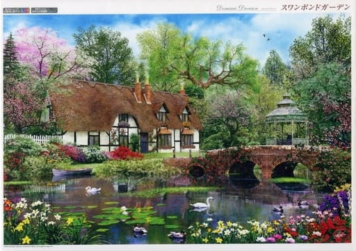 An idyllic cottage with a thatched roof sits beside a pond with swans, a stone bridge, and a gazebo in a lush garden.