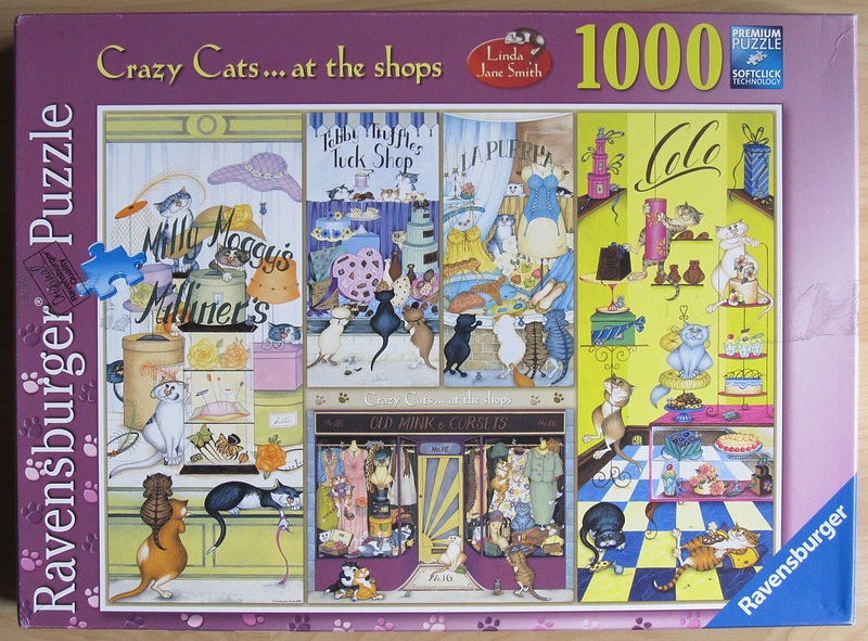 A whimsical illustration of various cats interacting with different shop window displays including a milliner and a boutique.