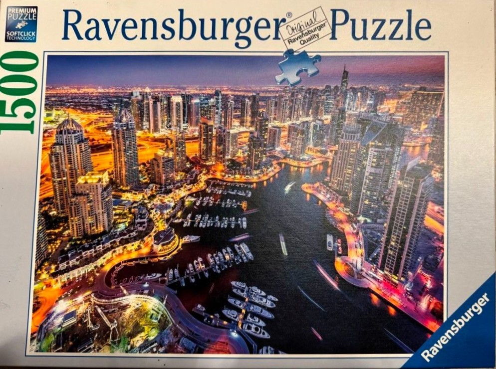 Aerial view of Dubai Marina skyscrapers and yachts at twilight
