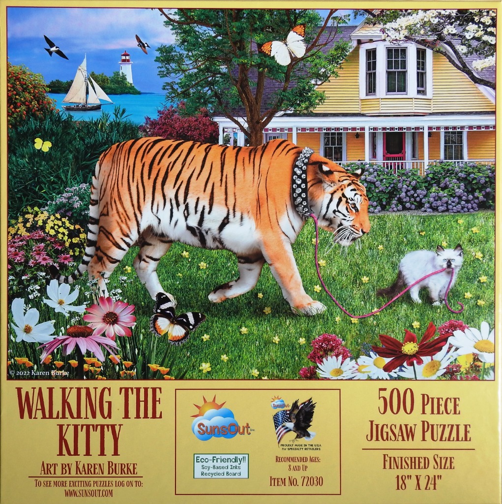 A tiger wearing a studded collar walks a small kitten on a leash in a sunny garden with a yellow house in the background.