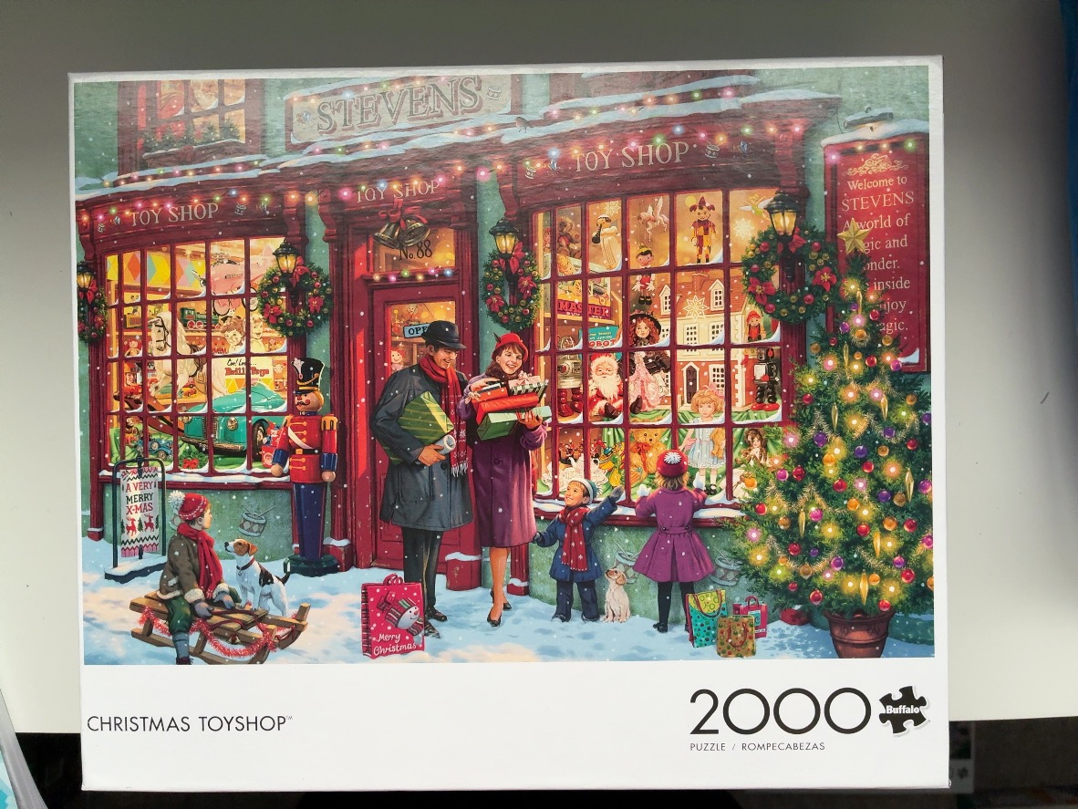 A nostalgic, snowy Christmas scene featuring a family admiring a decorated toy shop window at night.
