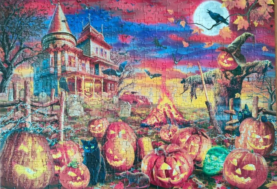 A whimsical, colourful Halloween illustration of a haunted house, jack-o