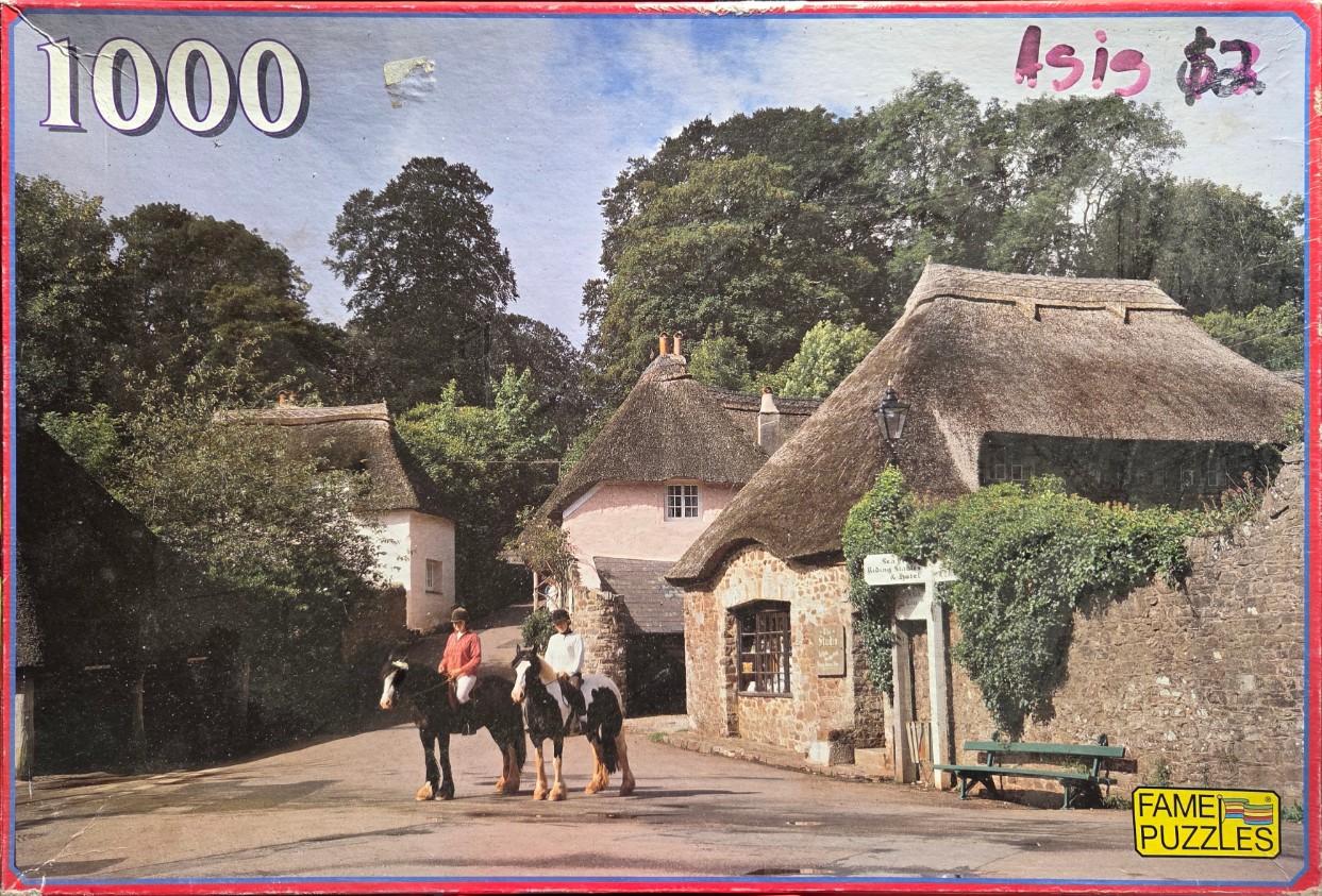 Two riders on horses in a picturesque English village with thatched-roof cottages.
