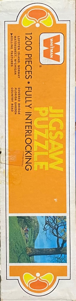 Vintage 1200 piece jigsaw puzzle of a scenic country road with a covered bridge and rolling pastures in orange, yellow, and green.