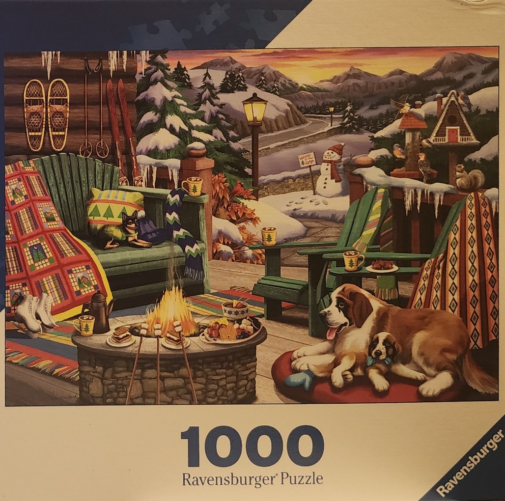 A cozy winter lodge scene with two dogs, a fire pit, and a snowy mountain landscape at sunset.