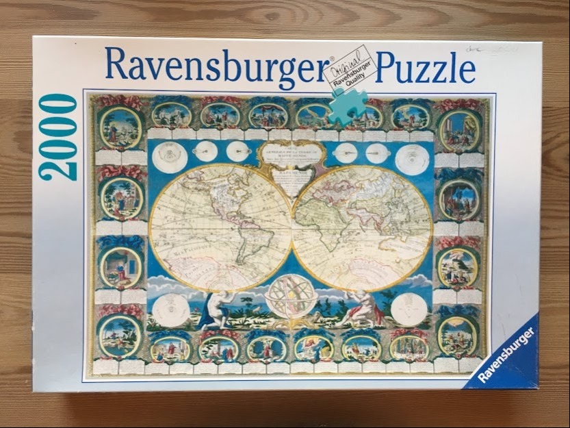 An antique style double-hemisphere world map surrounded by circular vignettes of classical scenes.