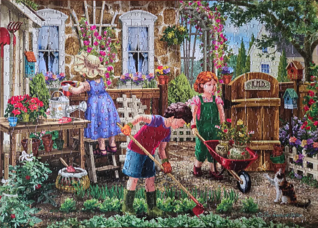 Three children gardening in front of a rustic stone cottage